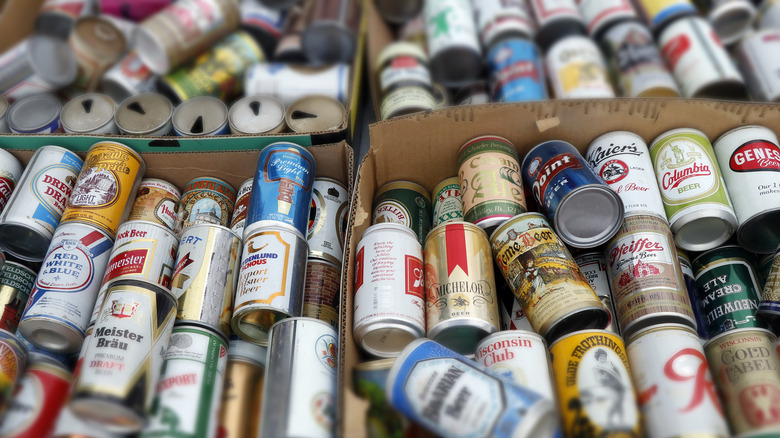 Boxes of assorted vintage beer cans