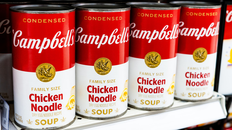 cans of Campbell's Chicken Noodle Soup stocked on store shelf