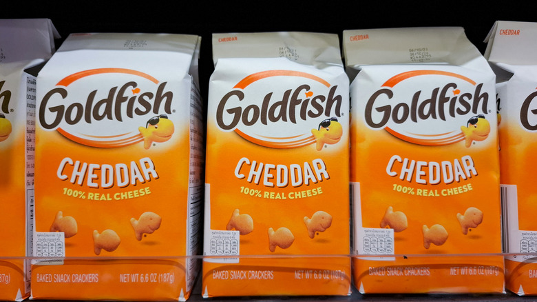 Packages of Cheddar Goldfish crackers lined up on the store shelf