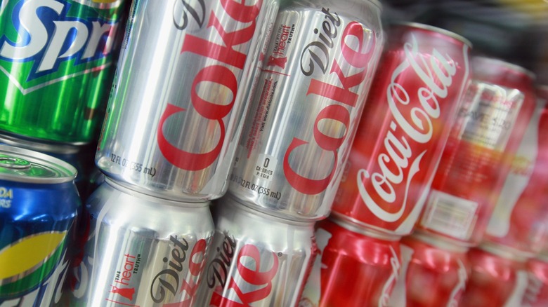 cans of coca-cola, diet coke, and sprite