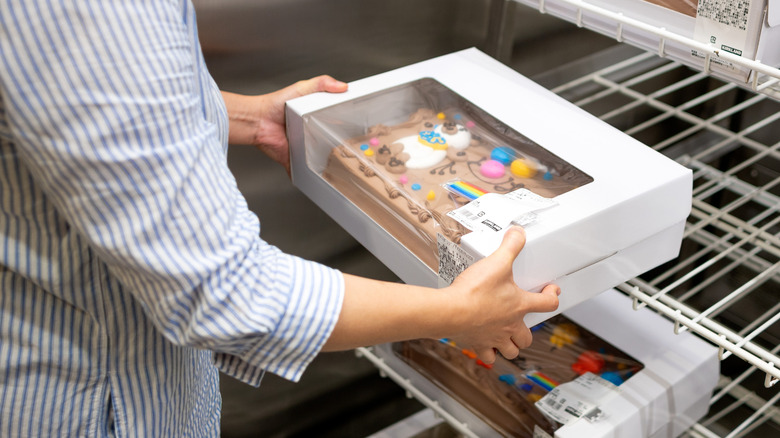 shopper grabbing Costco cakes