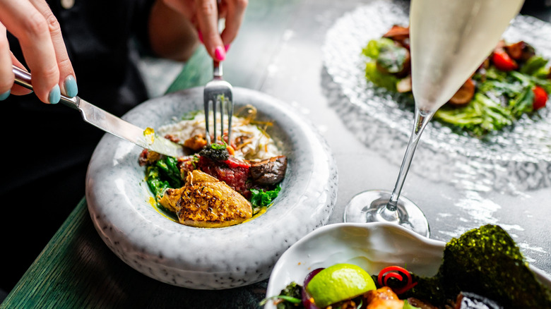 A fancy looking spread on a table at a fine dining restaurant
