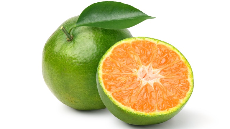 Green orange cut in half