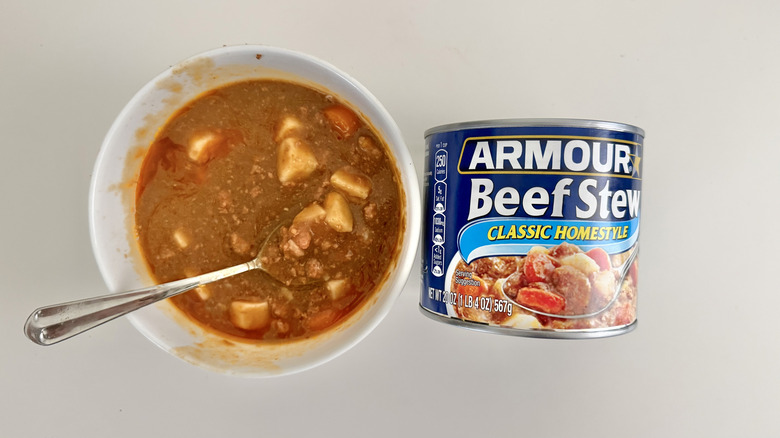 Can and bowl of Armour Star beef stew on a table.