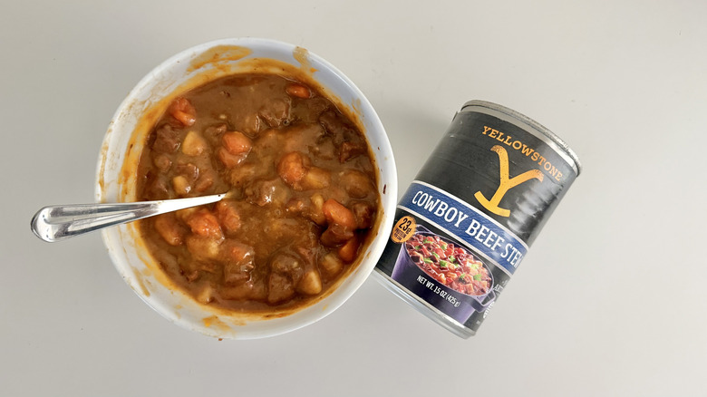 Can and bowl of Yellowstone beef stew on a table.