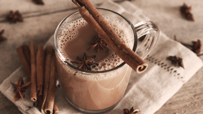 cup of chai tea with cinnamon sticks