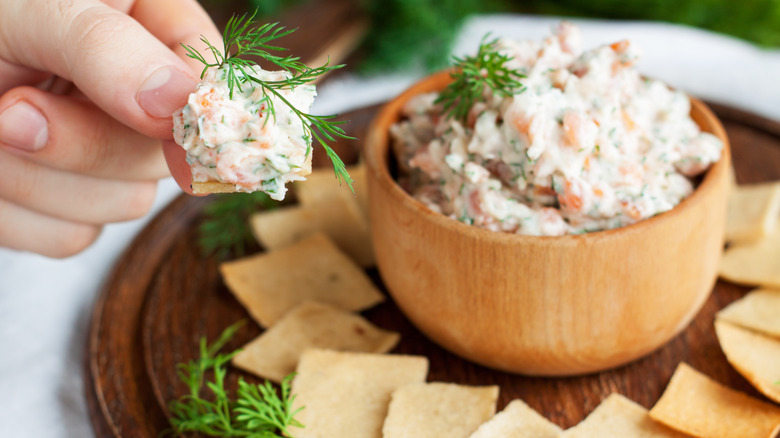 Salmon cream cheese dip on a cracker