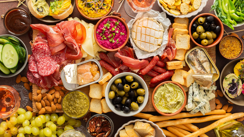 Charcuterie boar with tin of sardines.