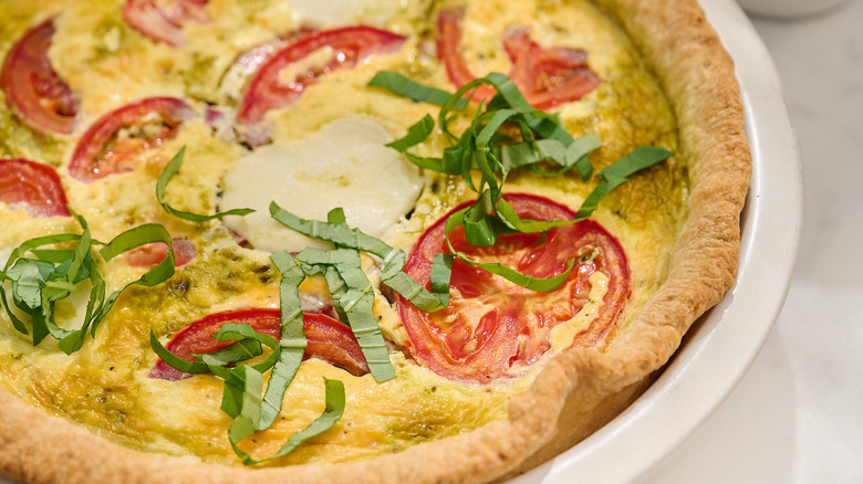 close up of tomato on a quiche