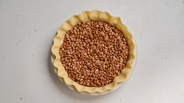 weighing crust down with beans