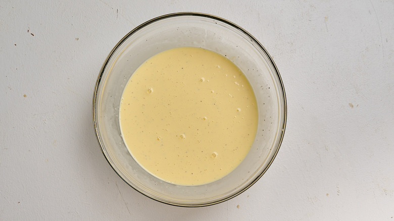 egg whisked with cream in a bowl