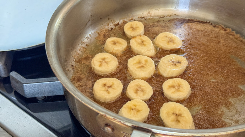 bananas cooking in butter/brown sugar mixture in skillet
