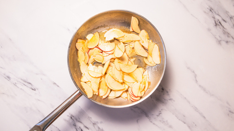 Apple slices in pan with butter