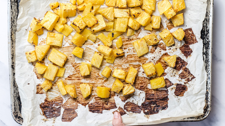 Roasted pineapple on baking sheet