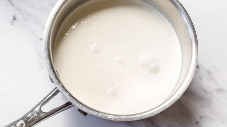 Cream and milk in saucepan