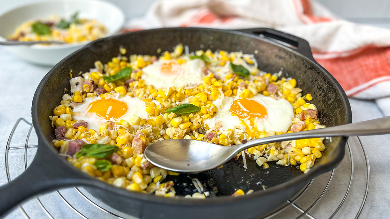 fried eggs with cooked corn