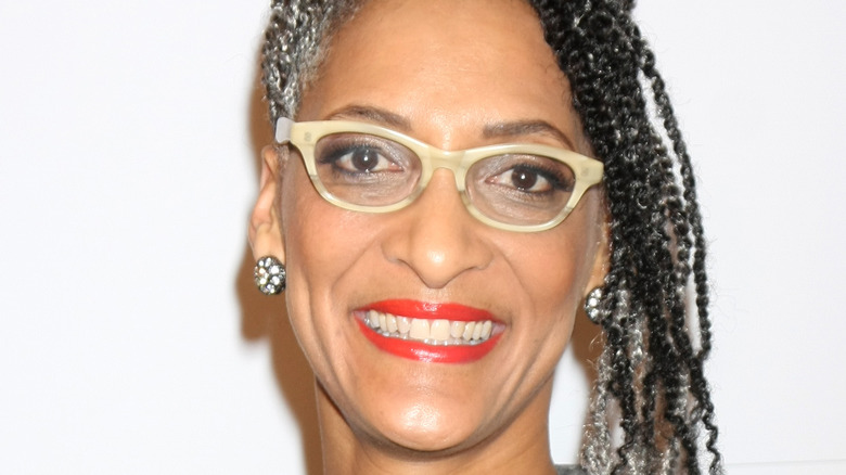 Carla Hall smiling with glasses