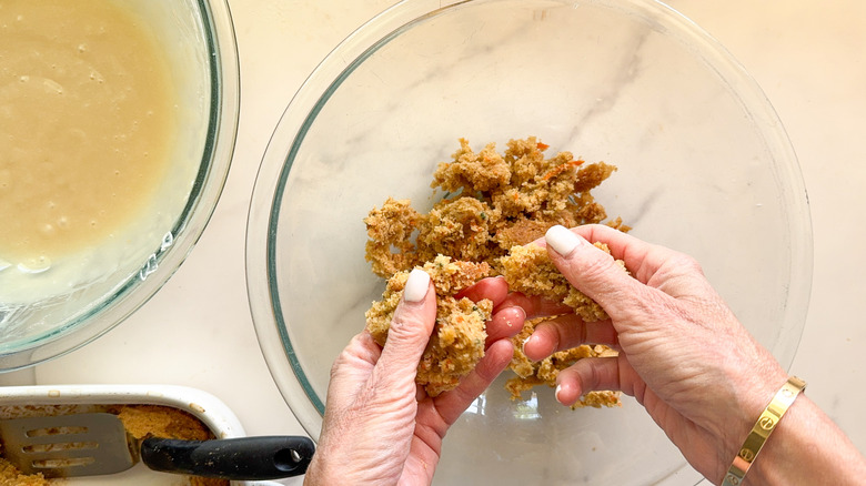 hands crumbling cake