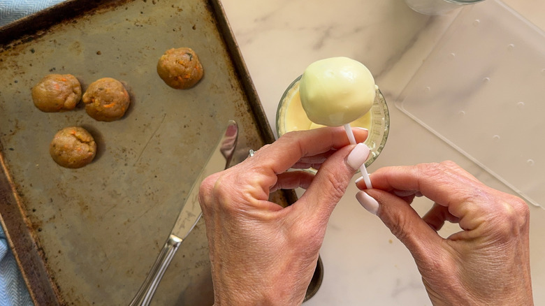hand holding coated cake pop