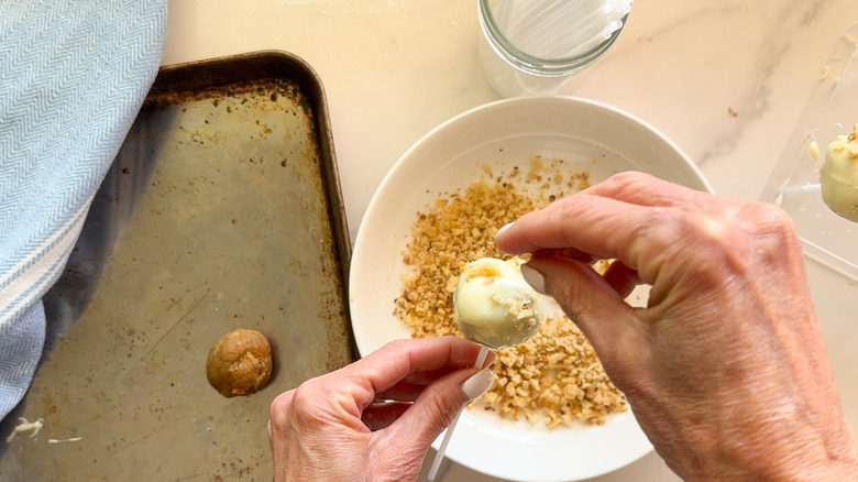 hands adding toppings