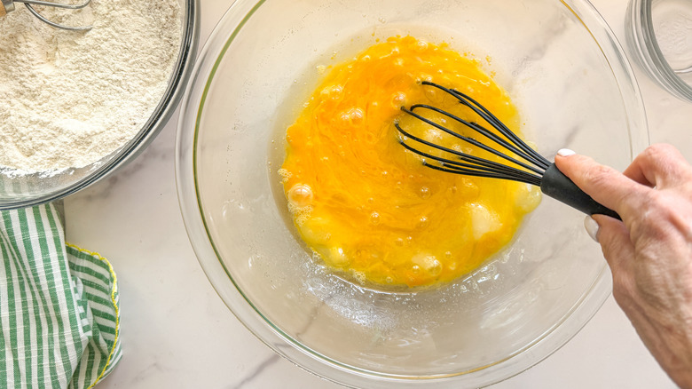 hand whisking eggs