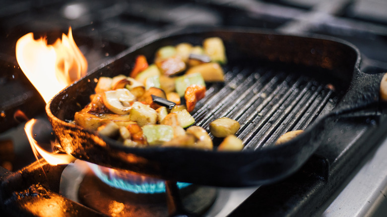 Hot cast iron pan with flames