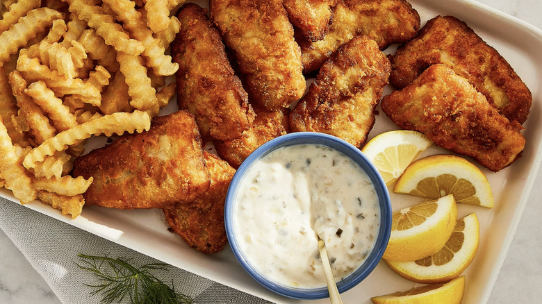 Great value frozen fish fillets with fries, tartar sauce, and lemons
