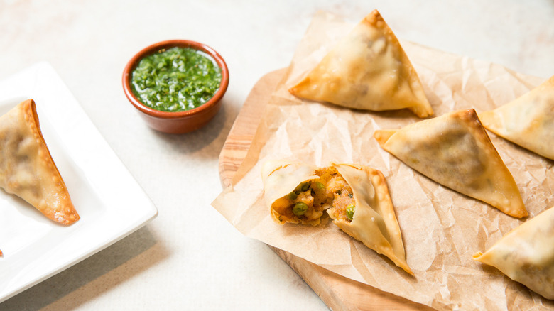 baked samosas served on table