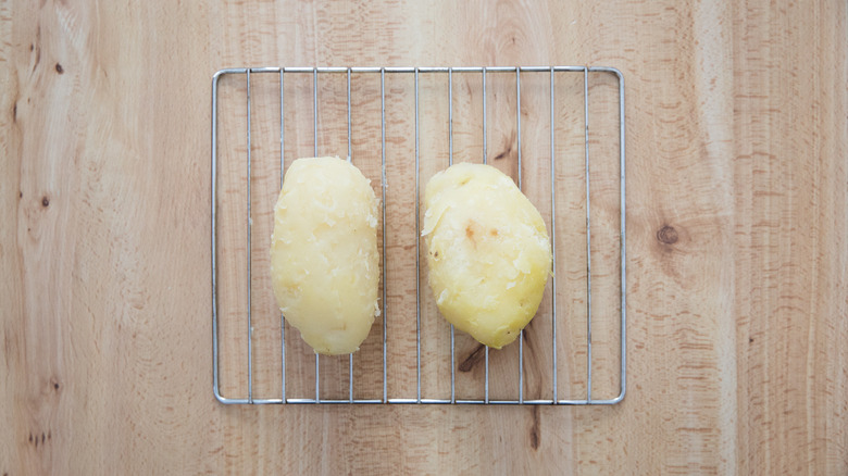 peeled potatoes on cooling rack