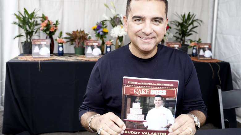 Bobby Valastro smiling with book