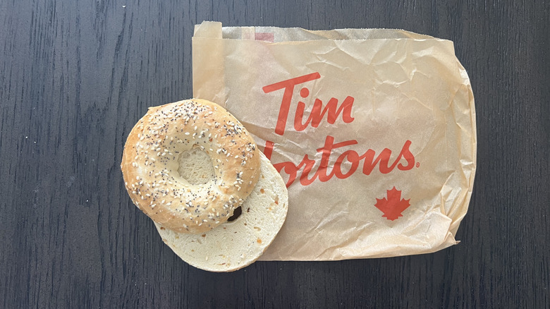 Top view of Tim Hortons' everything bagel sliced and served on to-go bag