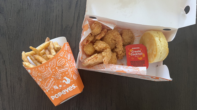 Popeyes shrimp tackle box with fries and a biscuit