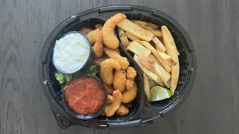 Red Robin's crispy fried shrimp meal with fries and sauces in a to-go container