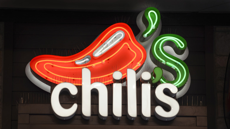 Lit-up Chili's sign on building