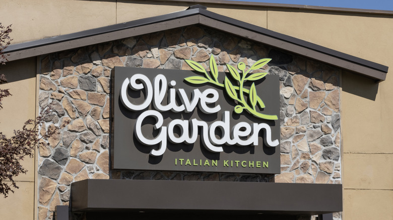 Olive Garden sign on stone building