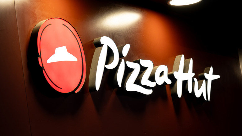 Pizza Hut sign with light