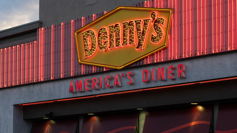 Lighted Denny's America's Diner signage on outside of restaurant