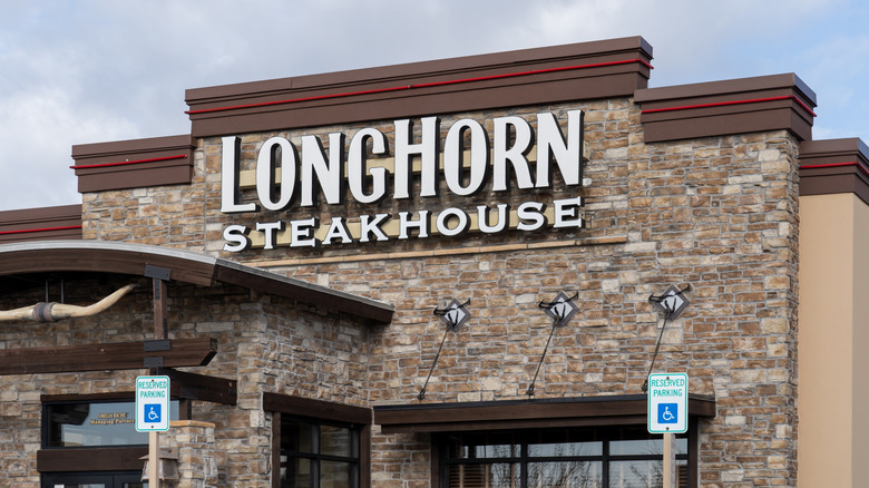 Longhorn steakhouse signage on outside of brick restaurant building