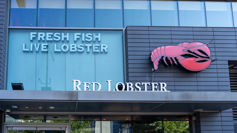 Signage of a large red lobster and store name on the outside of a restaurant