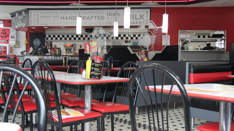 Interior of a Steak 'n Shake with tables and booths