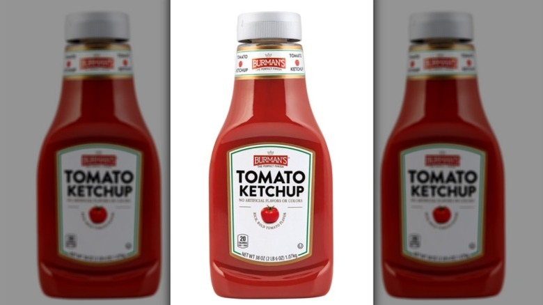 Bottle of ketchup on white background