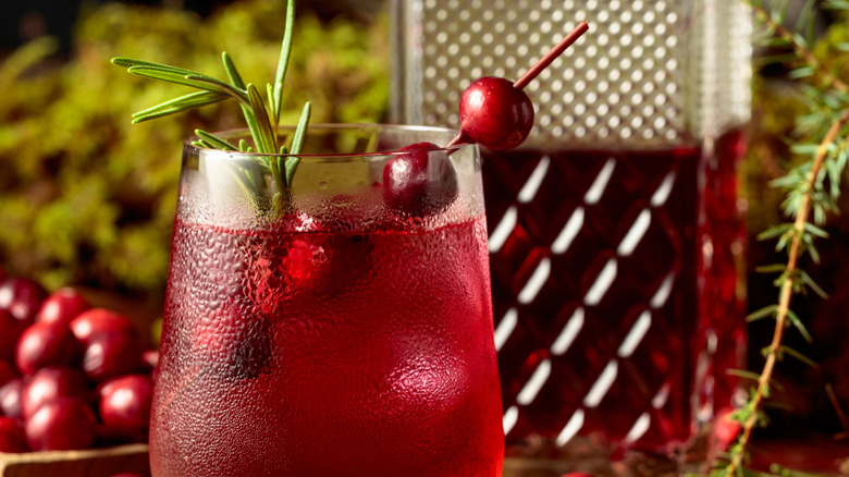 Cranberry Cocktail With a Liquor in the Background