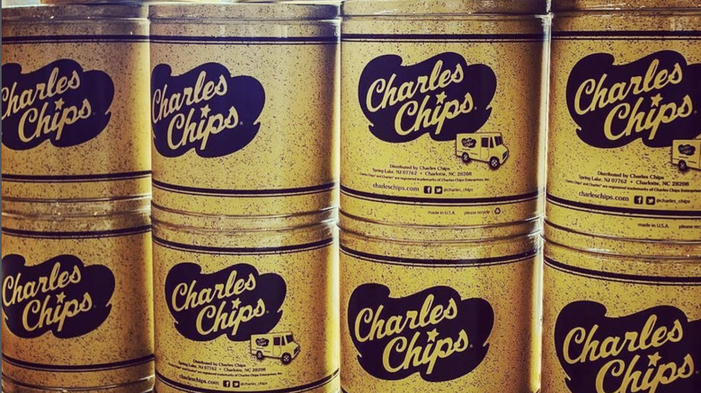 stack of yellow snack cans