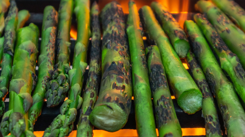 asparagus charring over cast iron grill grates
