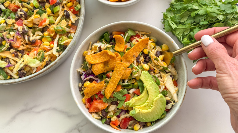 hand with fork in dressing