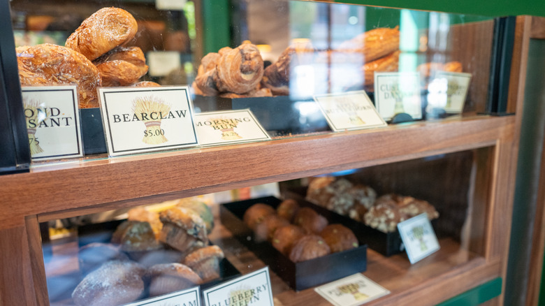 Bakery display case showing off various pastries and their prices