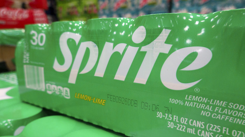A case of Sprite sealed with green plastic