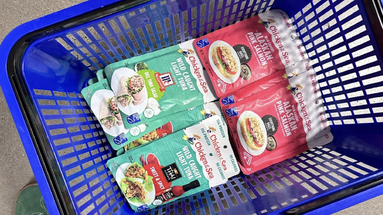 Chicken of the Sea packets in blue shopping basket