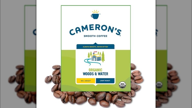 Cameron's Woods and Water coffee logo with coffee beans isolated on white background