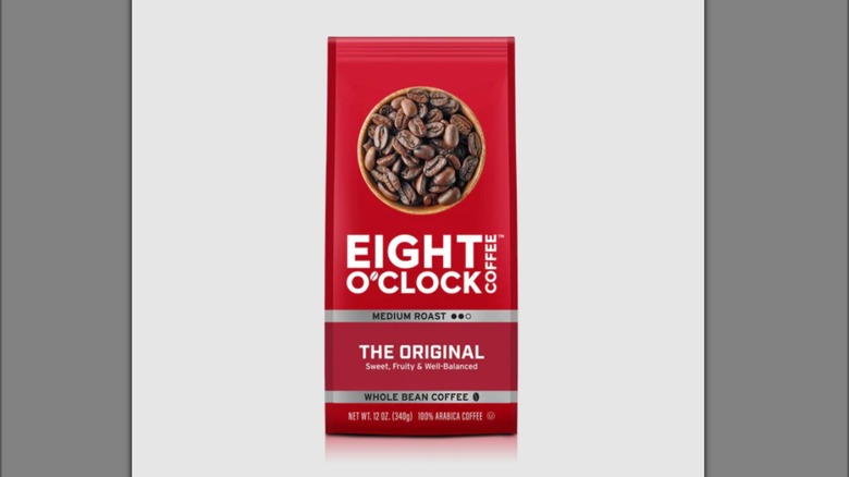 Red bag of Eight O'Clock original coffee isolated on grey background